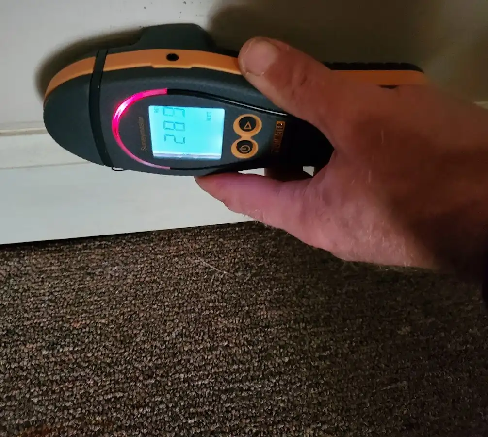Moisture detection at baseboard during Storm Damage Restoration in Elmsford